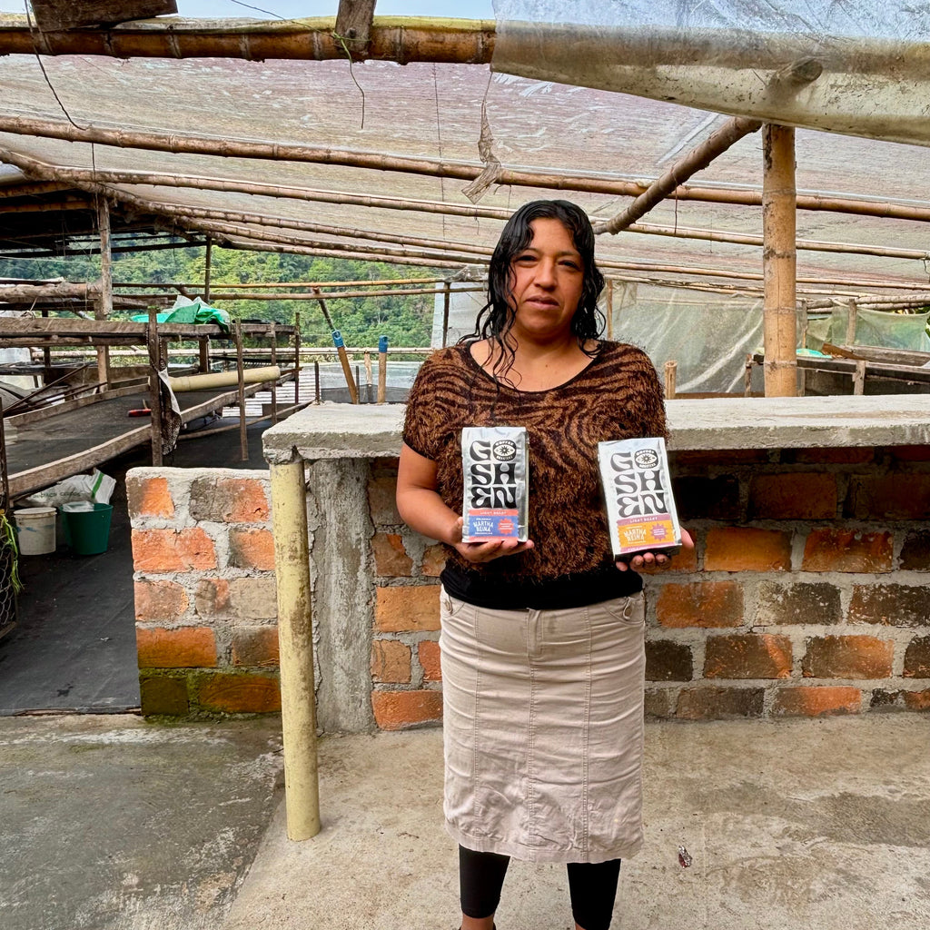 Martha proudly showing off her coffees roasted by Goshen.